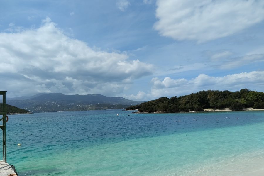 Ksamil beach on the Albanian Riviera with turquoise water and small islets offshore
